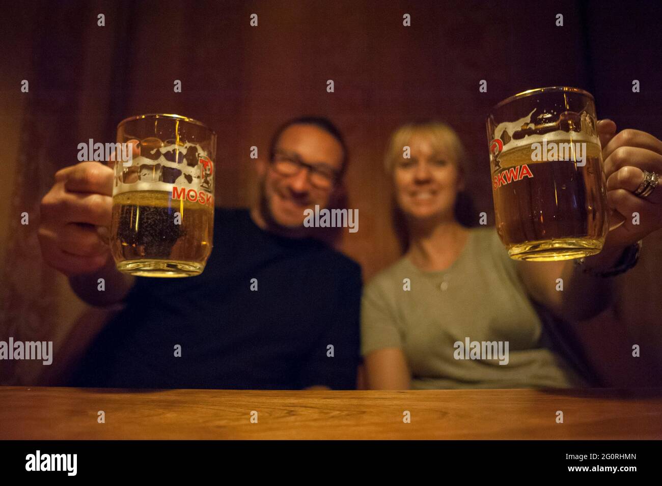 Enjoying traditional street food / restaurants in Berlin Germany and drinking beer Stock Photo