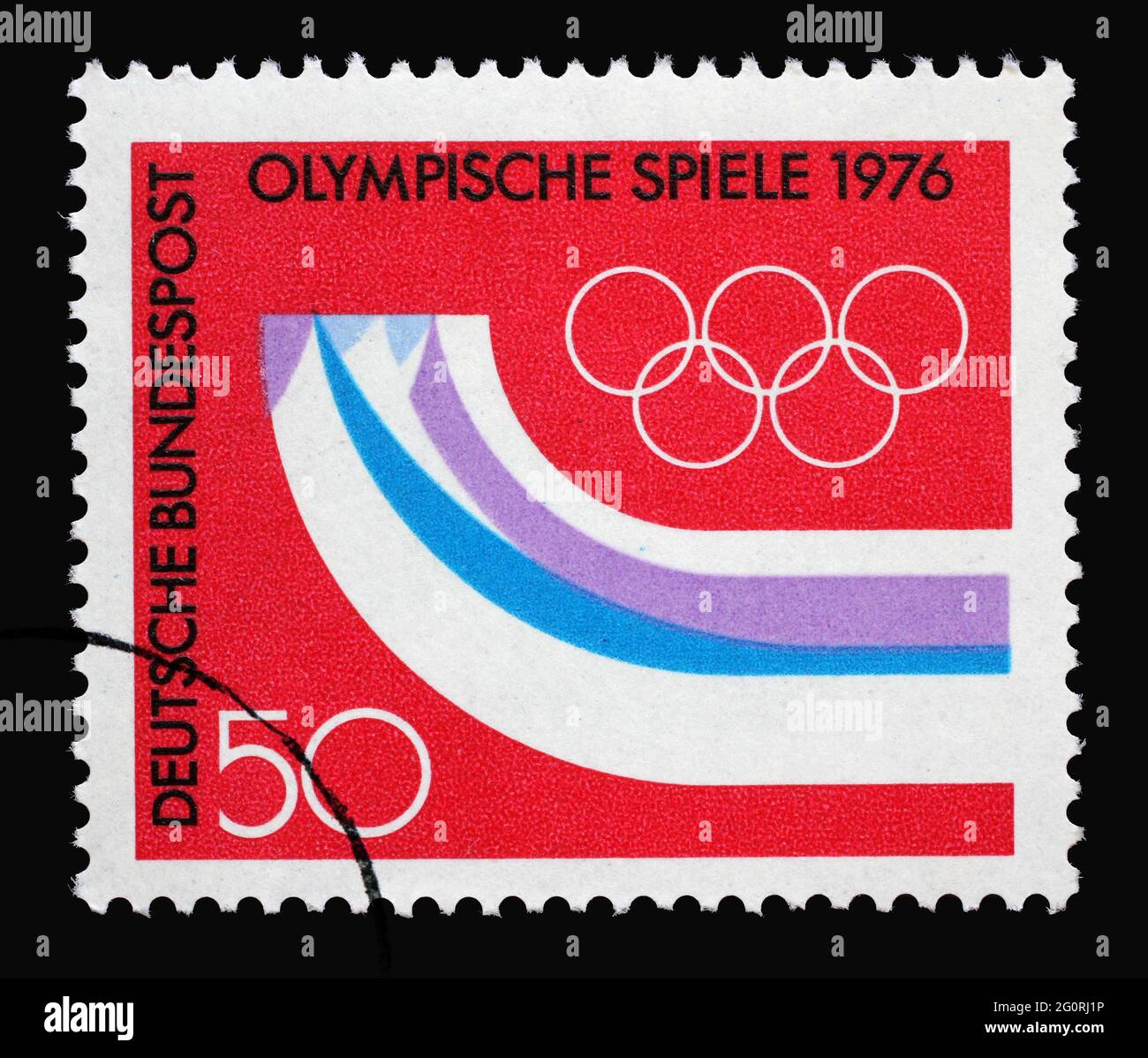 A stamp printed in Germany shows Stylized mountains in the form of runners, 12th Winter Olympic Games, Innsbruck Austria, circa 1976 Stock Photo