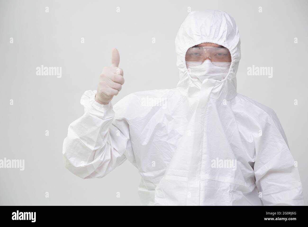 Asian nurse or doctor in Personal Protective Equipment or PPE suit ...