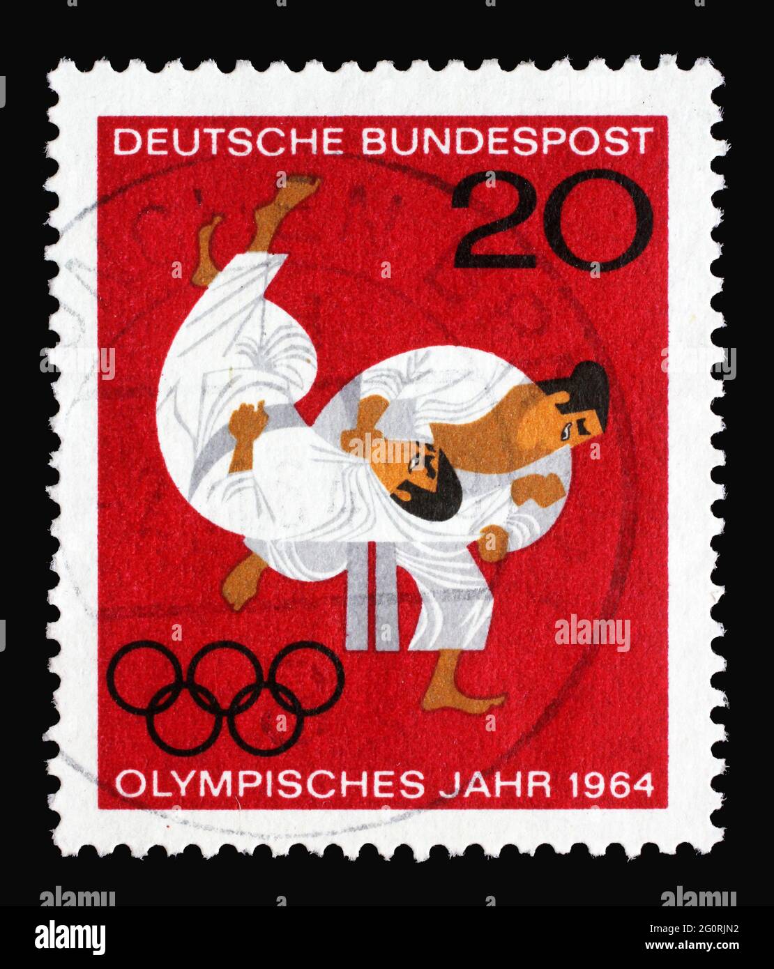 Stamp printed in Germany showing Olympic Games in Tokyo, Japan Judo, olympic rings, circa 1964 Stock Photo