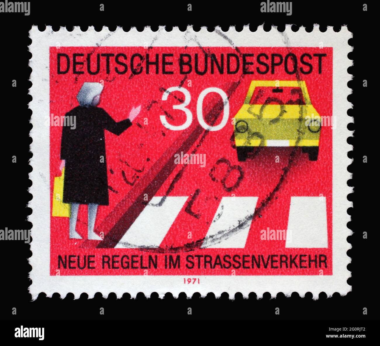Stamp printed in Germany shows Give priority to pedestrians at the crosswalk, give hand sign, circa 1971 Stock Photo