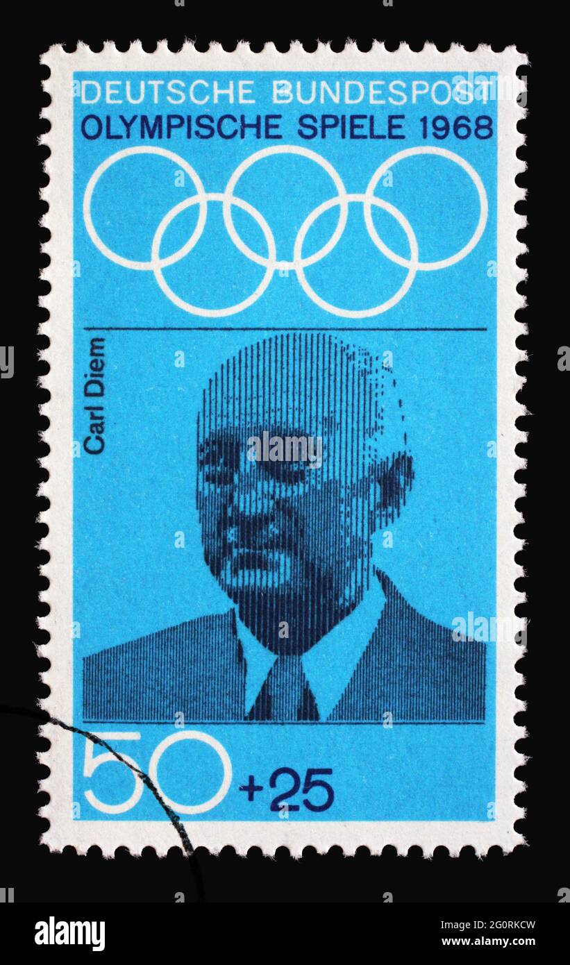 Stamp printed in Germany showing portrait of Carl Diem, sports organizer and teacher, 1968 Summer Olympics, the Games of the XIX Olympiad, Mexico City Stock Photo