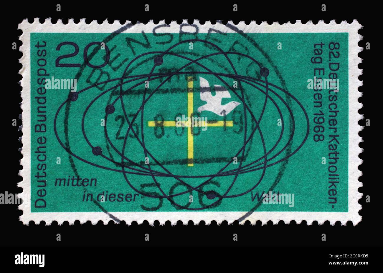 Stamp printed in Germany showing Cross and dove in center of universe, German Catholic Day Essen, circa 1968 Stock Photo