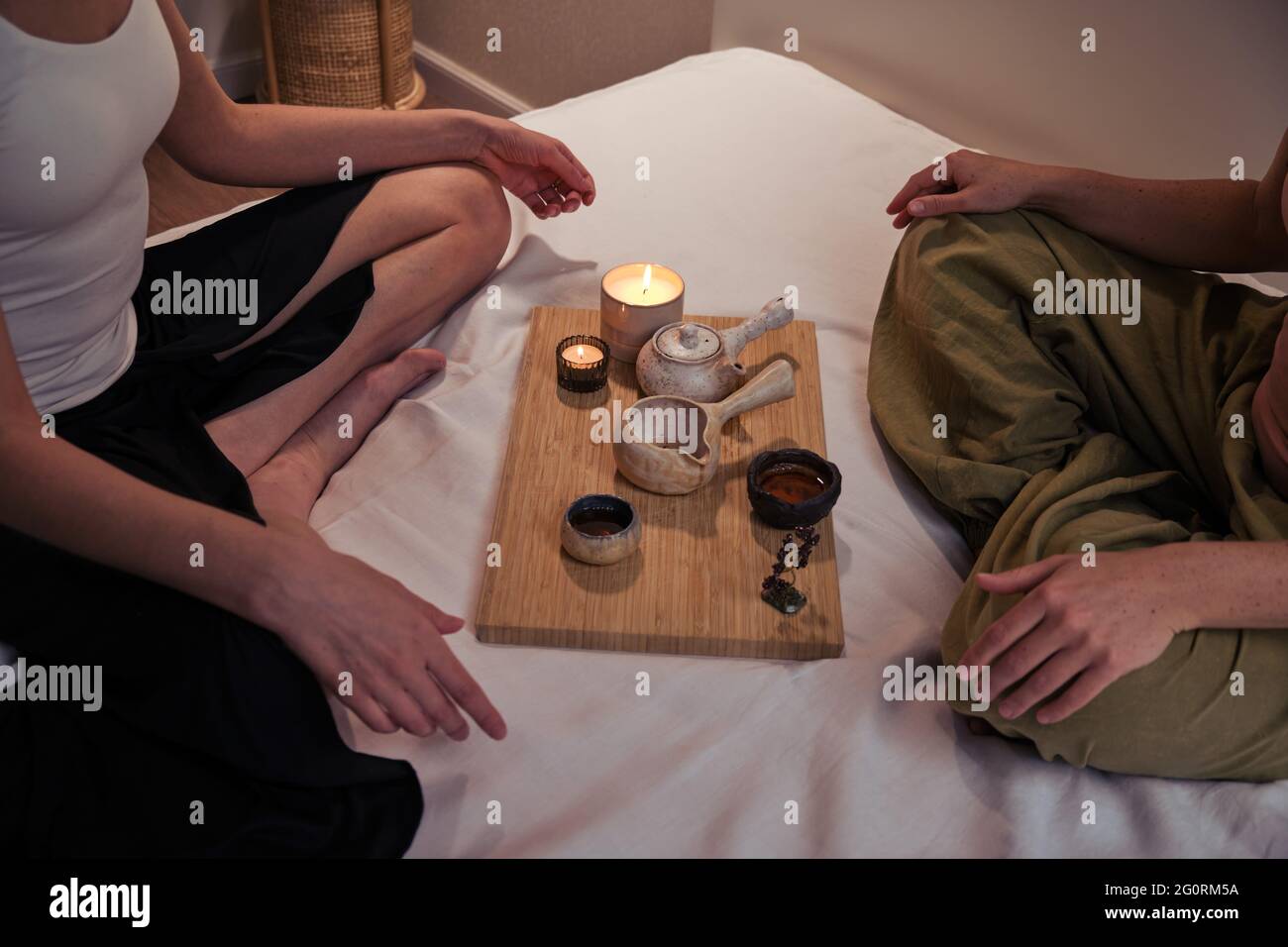 Tea ceremony before massage on the home bed in the bedroom Stock Photo ...