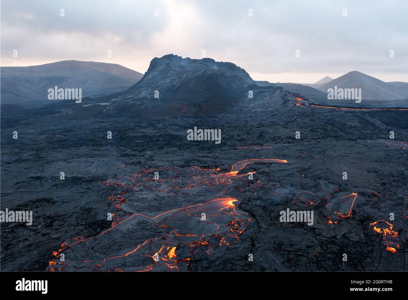 MAY 2021: The broader Fagradalsfjall volcanic system comprises an area of eruptive fissures (fissure swarm), cones and lava fields in the southern part of the Reykjanes peninsula. A strong seismic crisis began in the area near Fagradalsfjall since late Feb 2021, interpreted as intrusion of magma at shallow depth. This led to the first historic eruption of the volcano on 19 March 2021. Stock Photo