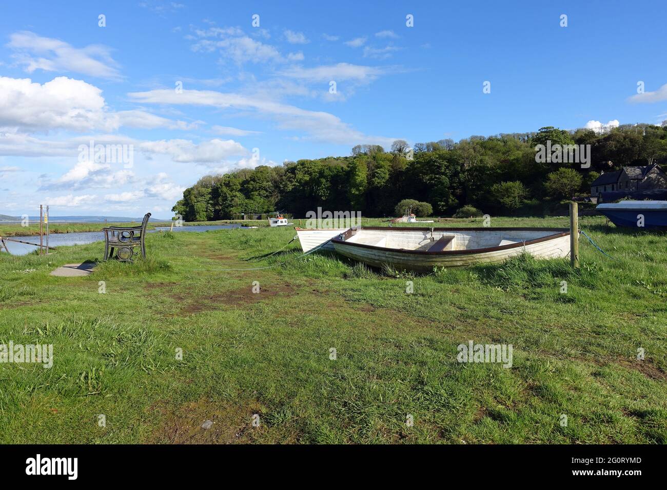 Boats on the foreshore of the River Coran Estuary, Laugharne, Carmarthenshire, Wales Stock Photo