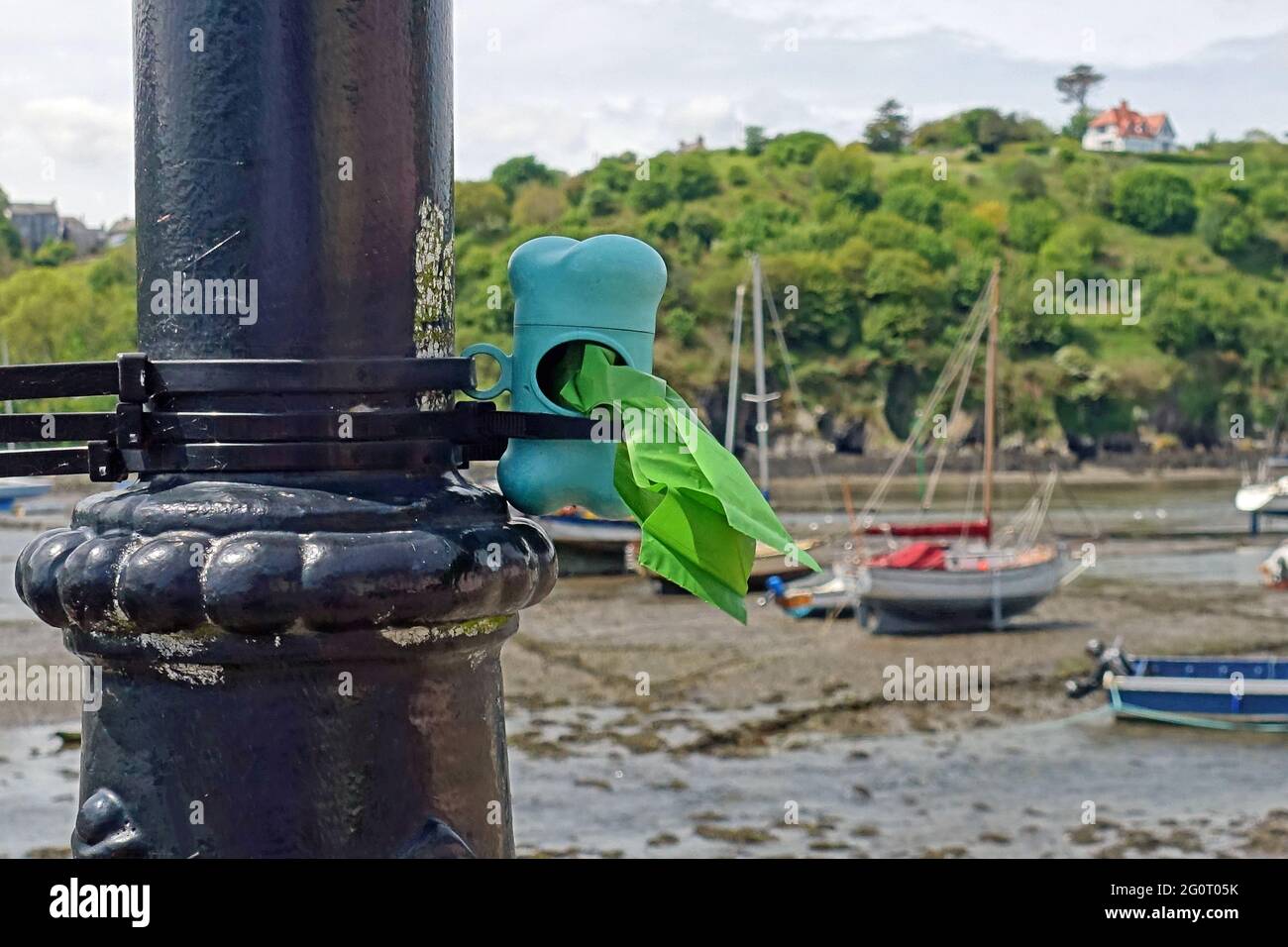 Doggy poop bags free for all on the quayside at Fishguard Old Town Harbour Stock Photo