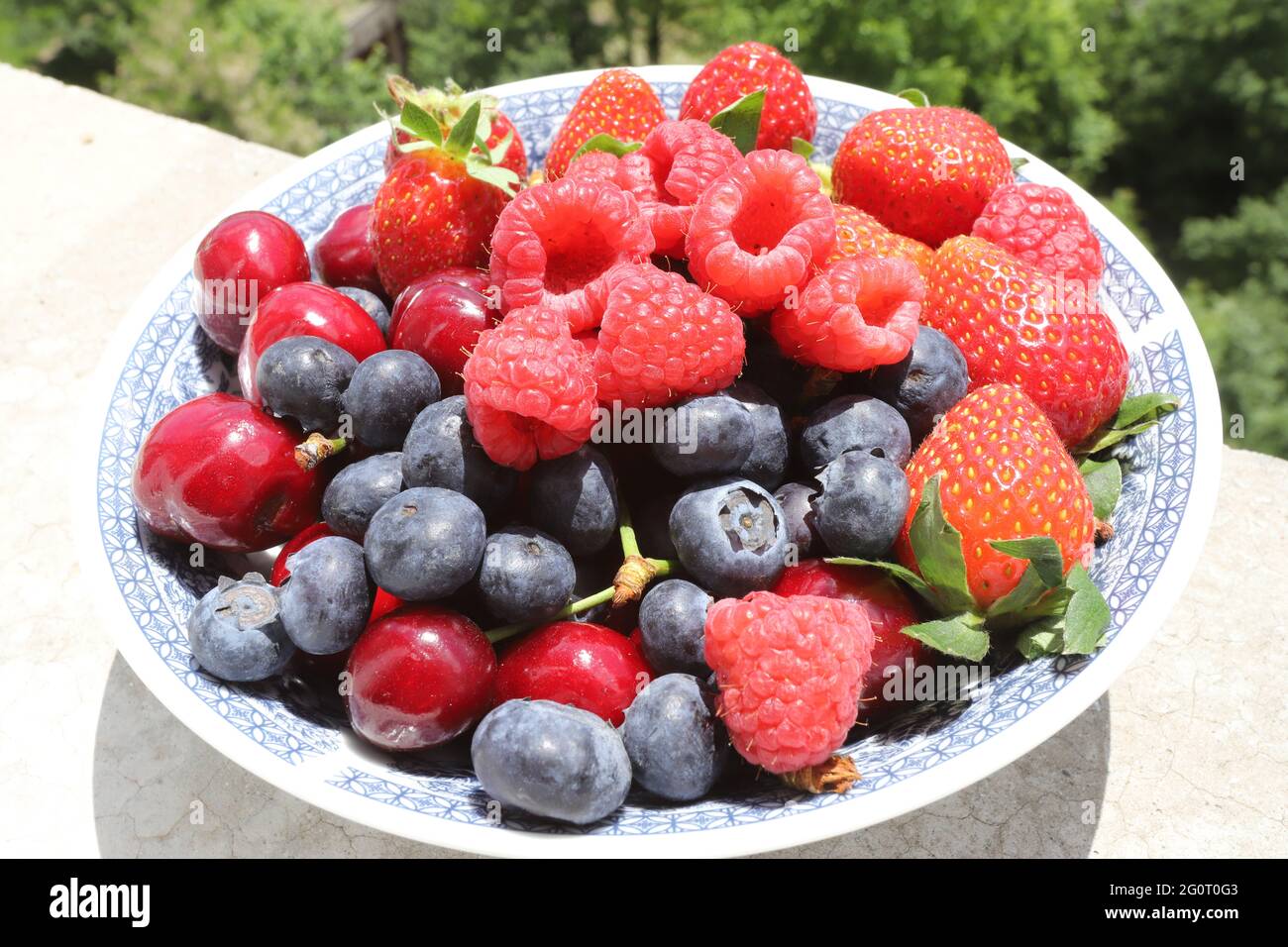 Close up of fresh fruits and berries on daylight Stock Photo