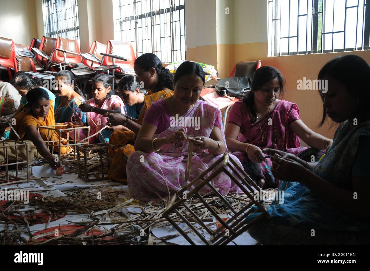 Women doing cane work in a Self Help Group (SHG) in rural areas near Gawhati of Assam, India for income-generating activities with proper market linka Stock Photo