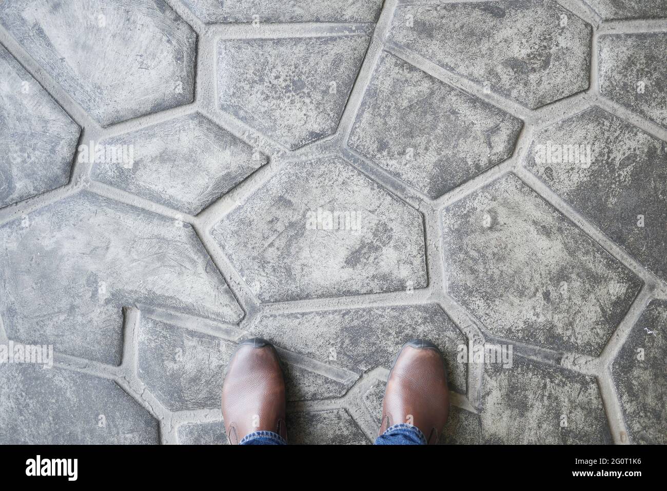 man in shoe on the concrete floor. pov Stock Photo Alamy