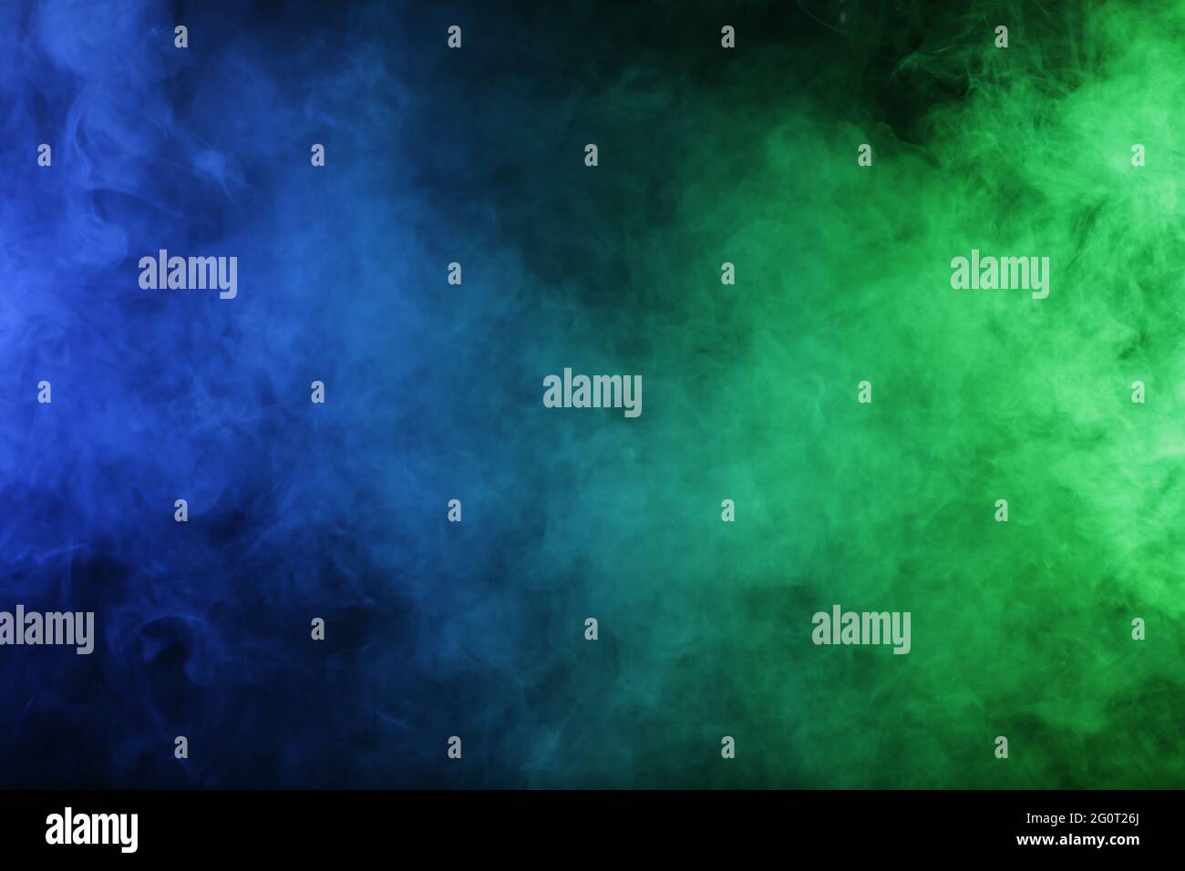 Smoke in blue green light on black background Stock Photo - Alamy