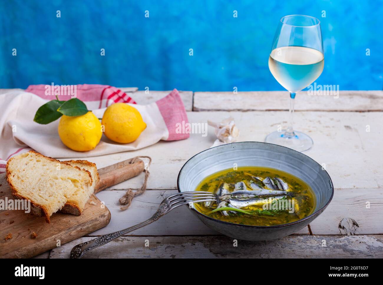 Marinated anchovies in lemon juice with olive oil garlic and parsley. Traditional mediterranean