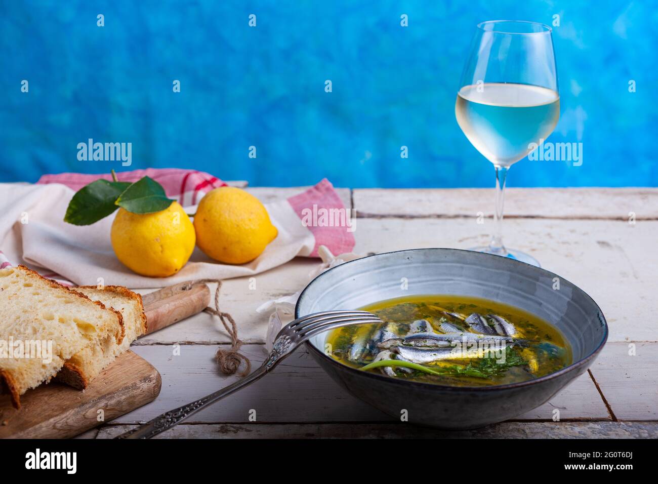 Marinated anchovies in lemon juice with olive oil garlic and parsley