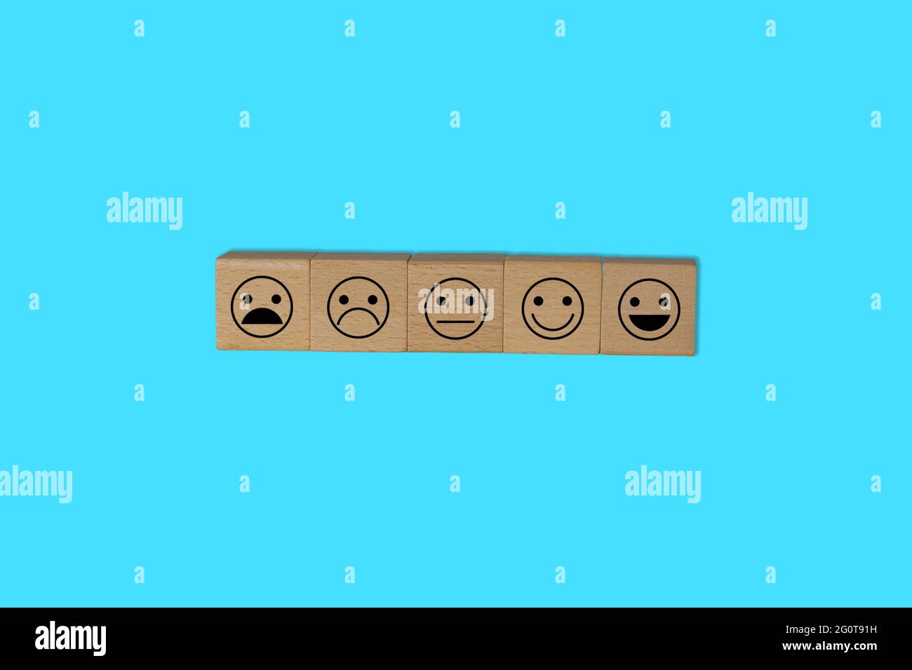 Scale of 5 smilies symbolizing the customer satisfaction survey scale. Feedback/evaluation from customers. Stock Photo