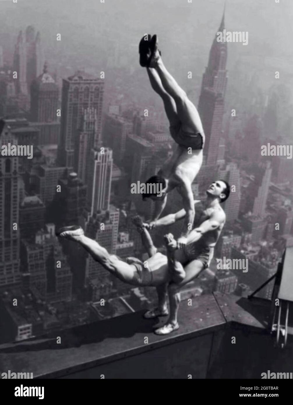 High risk balancing act above the city streets Stock Photo