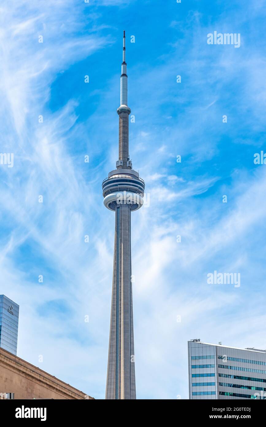 The CN Tower, vertical image, in the Toronto city downtown district, Canada. The telecommunications tower is considered a wonder of the modern world a Stock Photo