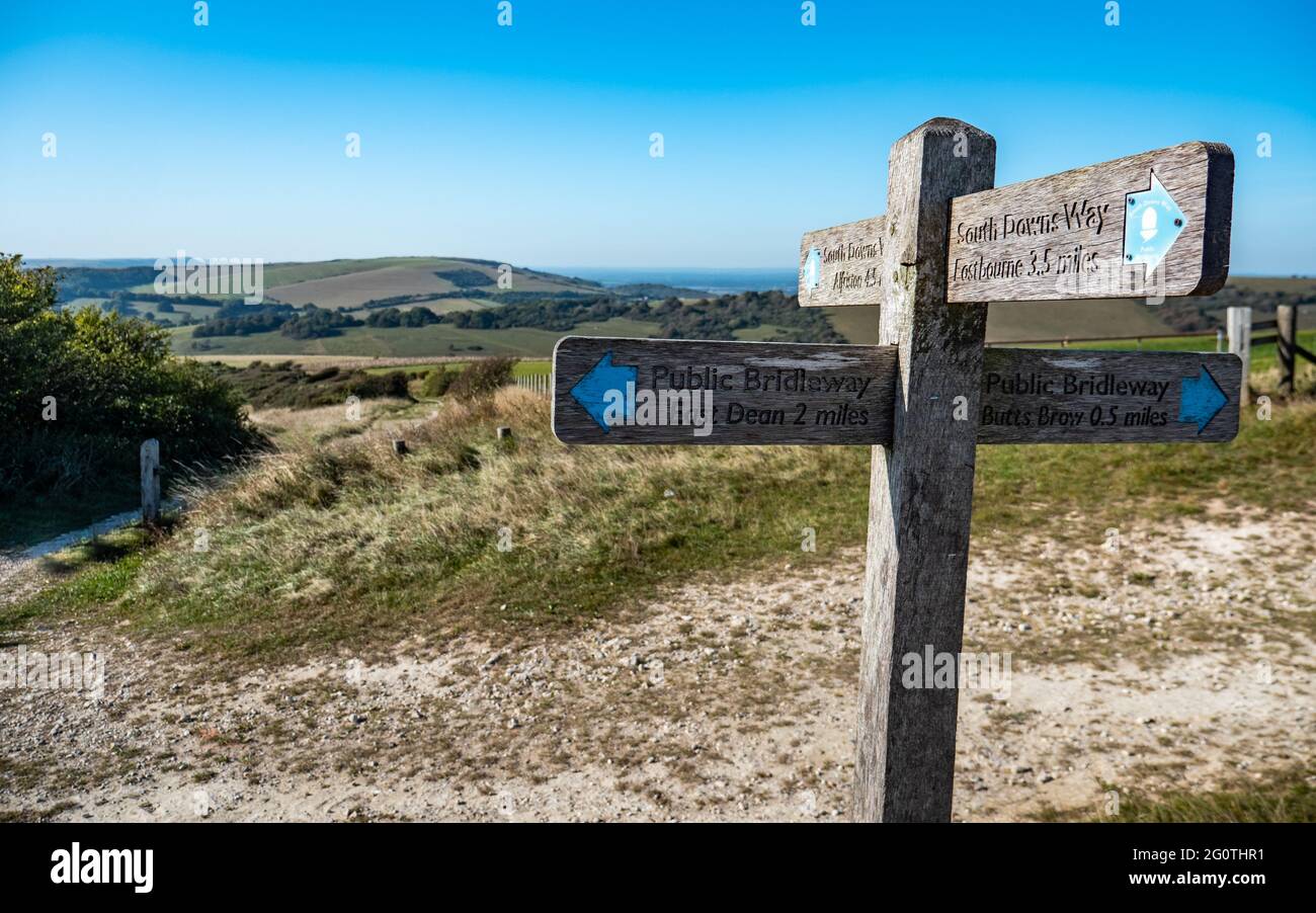 South Downs Way footpath sign giving directions along the 100 mile walking route through the south coast of England Sussex countryside. Stock Photo