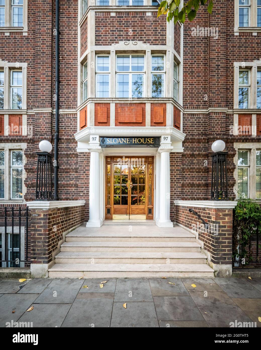 Art Deco mansion block entrance, London. Traditional British 1930's architecture of an apartment block near Sloane Square in affluent West London. Stock Photo
