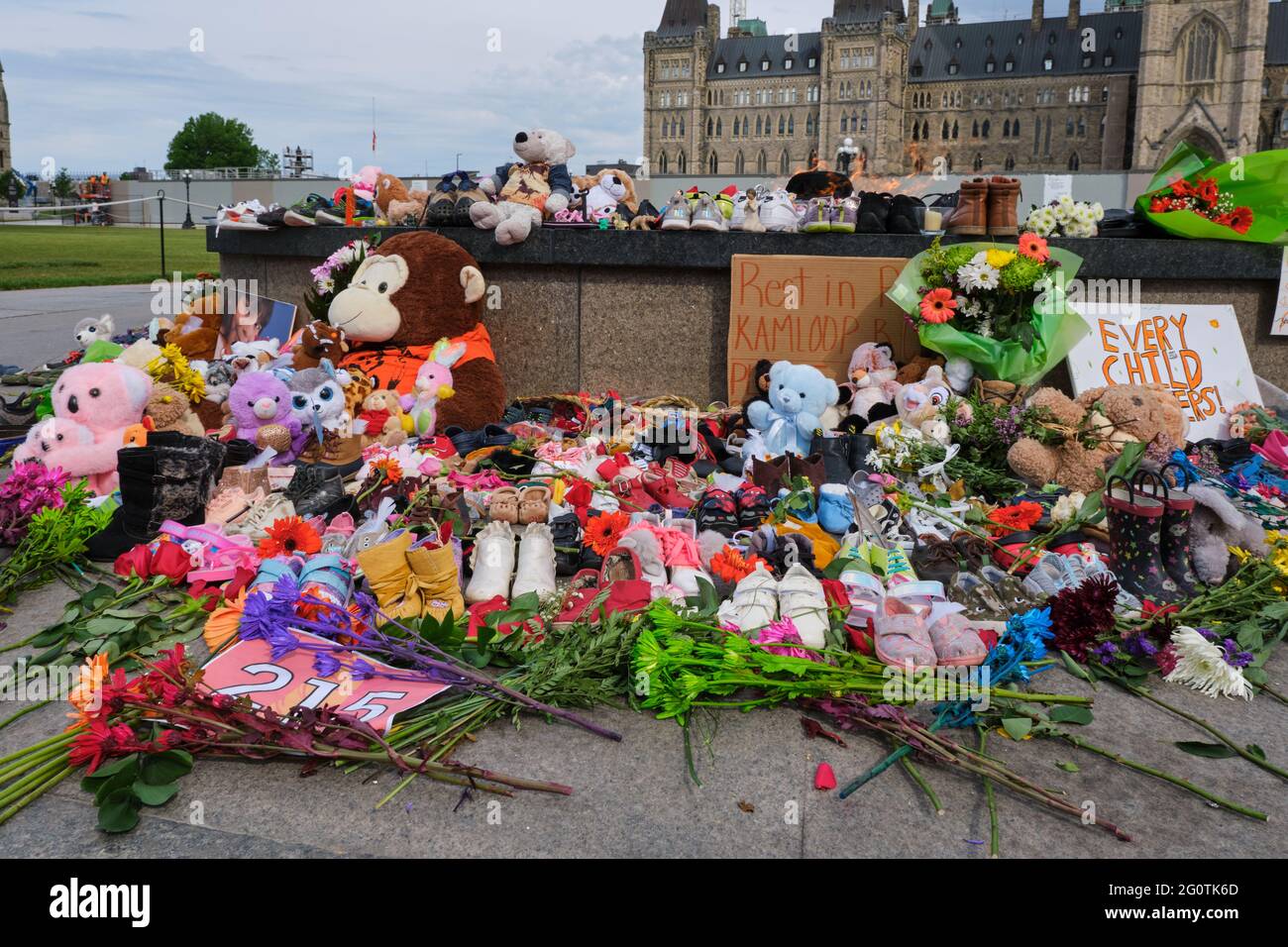 Ottawa, Canada. June 1, 2021. Memorial to 215 aboriginal children whose remain found in Residential School in Kamloops. Toys and shoes left. Stock Photo