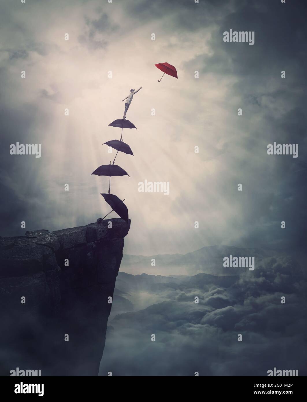 Surreal adventure, epic scene with a determined man climbing an improvised stairway of umbrellas, decided to reach a different one. Purposefulness and Stock Photo