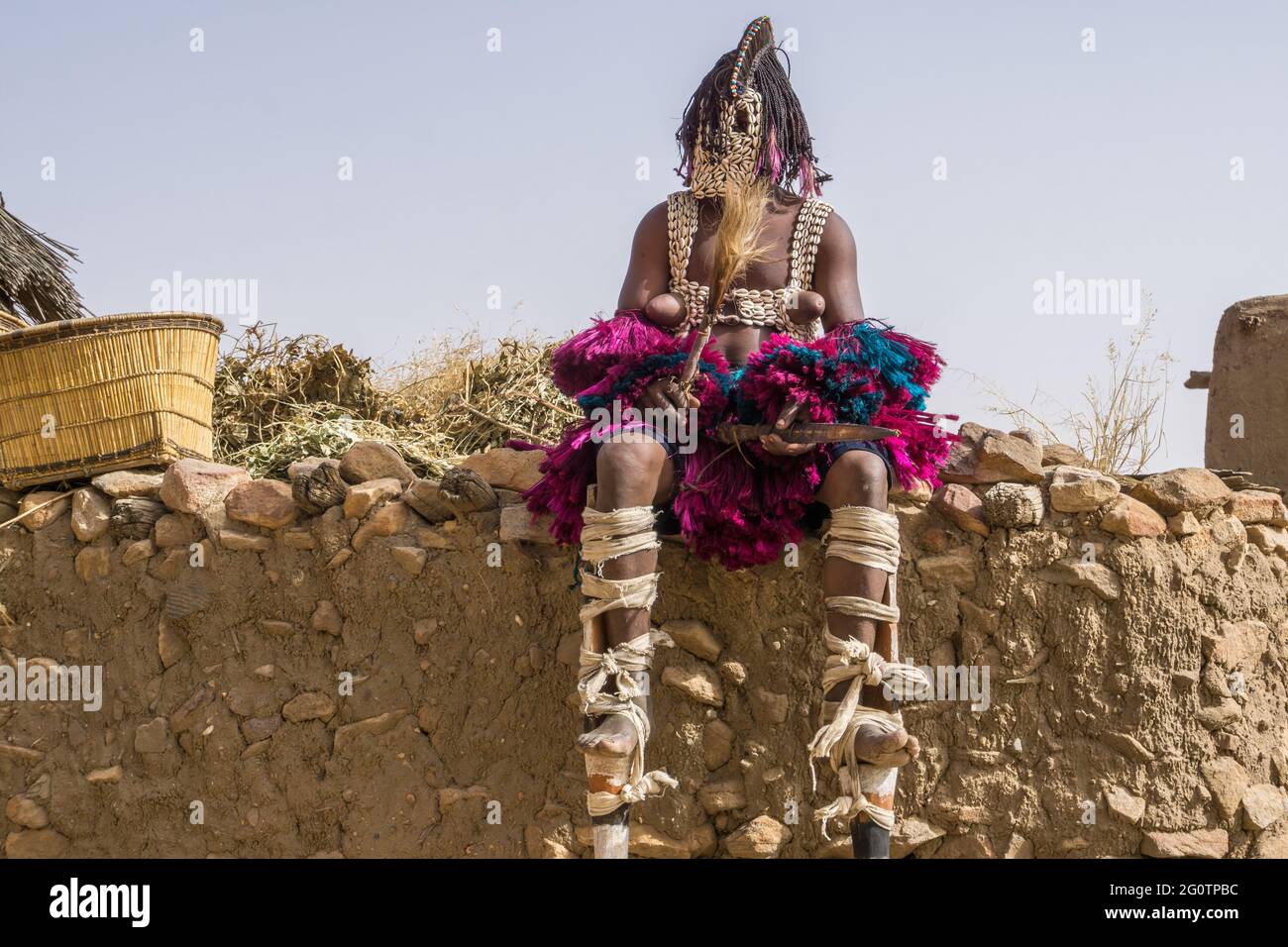 Mask dancers in the village of Tireli , Dogon country, Mali Stock Photo