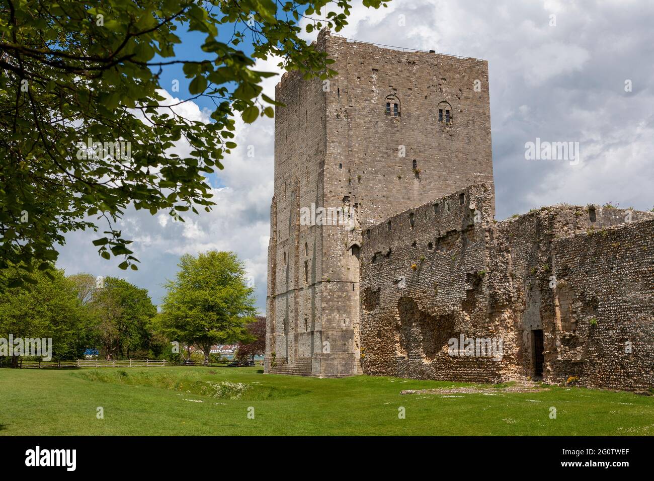 The Norman Keep of Portchester Castle, and part of the original Roman fort walls, Portchester, Hampshire, UK Stock Photo