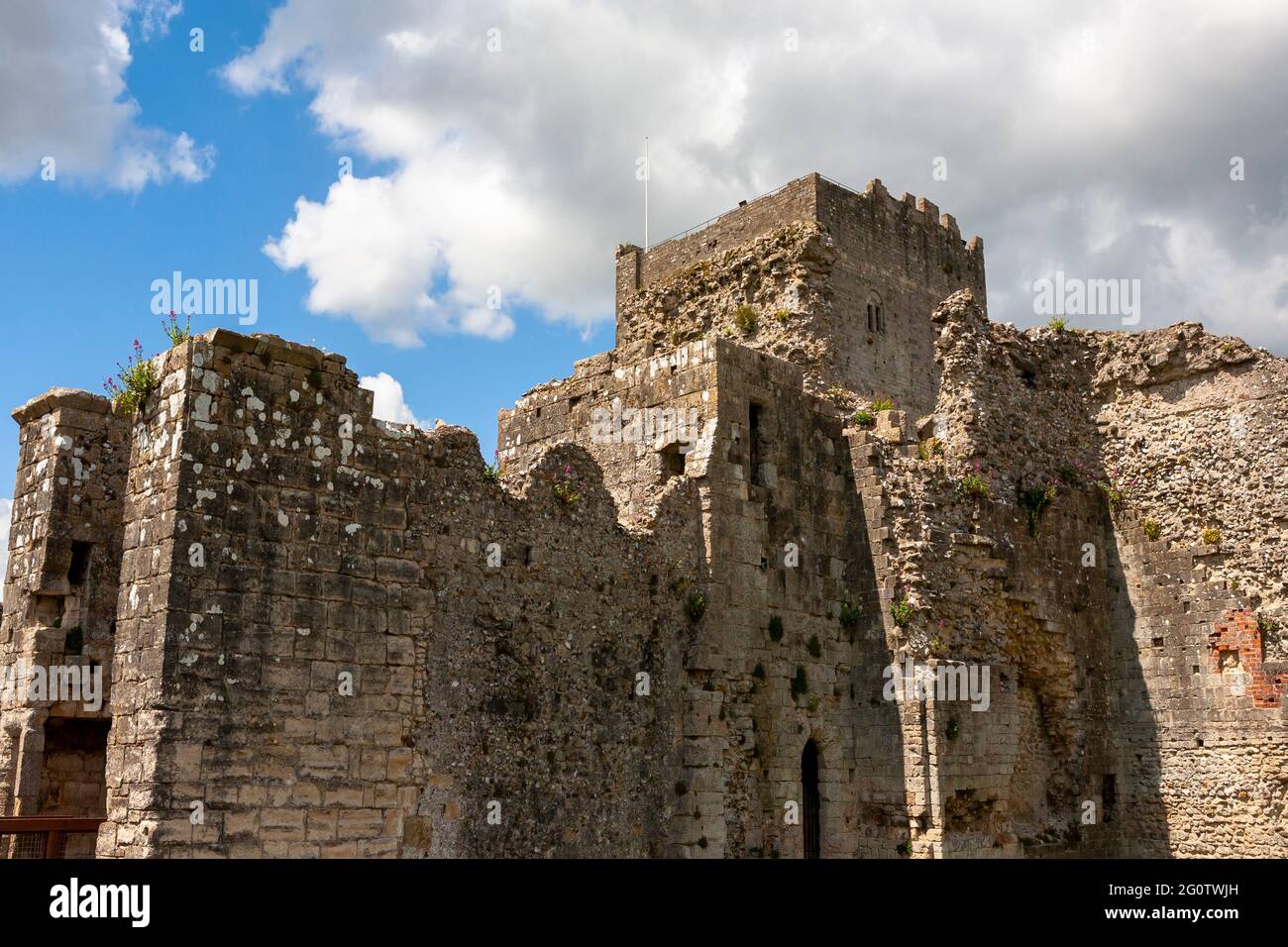 The Norman Keep of Portchester Castle and the walls of the Inner Bailey, Portchester, Hampshire, UK, from the outer Bailey Stock Photo