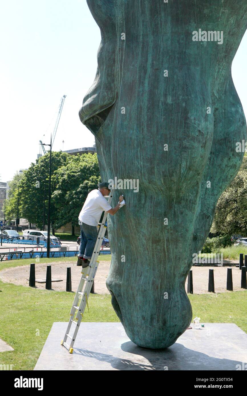 Artist Nic Fiddian-Green re-paints and waxes his 33 ft high bronze sculpture of a horse's head titled Still Water, on display at Achilles Way in Mayfair, London. Picture date: Thursday June 3, 2021. Stock Photo