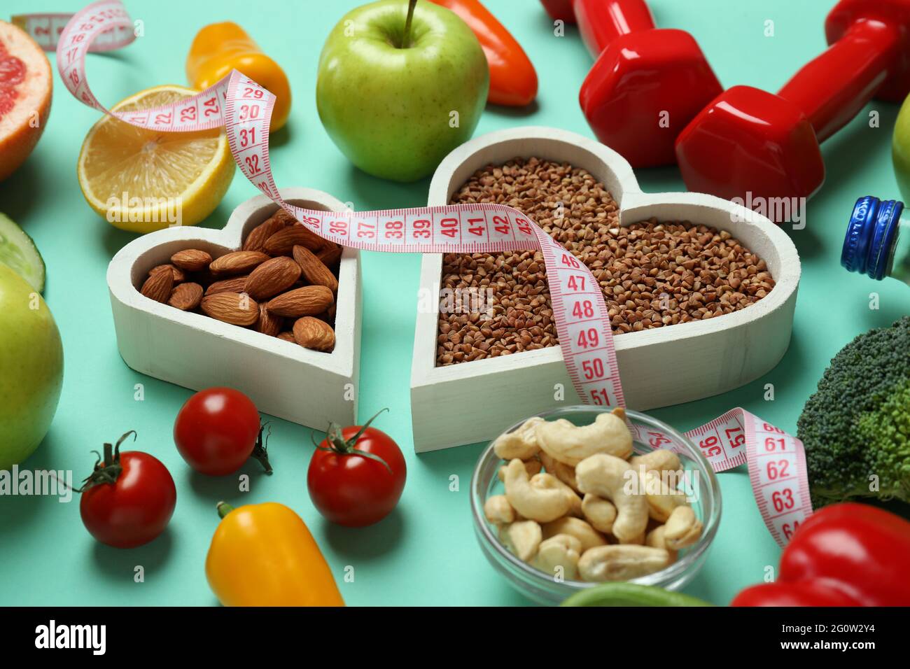 Different healthy lifestyle accessories on mint background Stock Photo