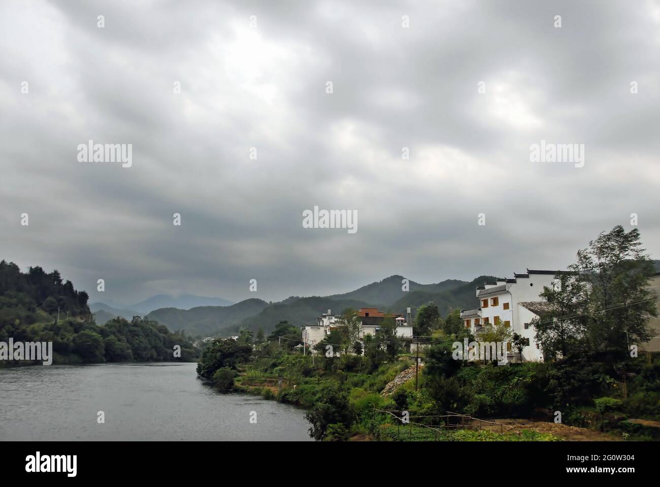 Wangkou in Wuyuan County, Jiangxi Province, China. Wangkou is an ancient town known for its Tang Dynasty architecture. Scenic view with river. Stock Photo