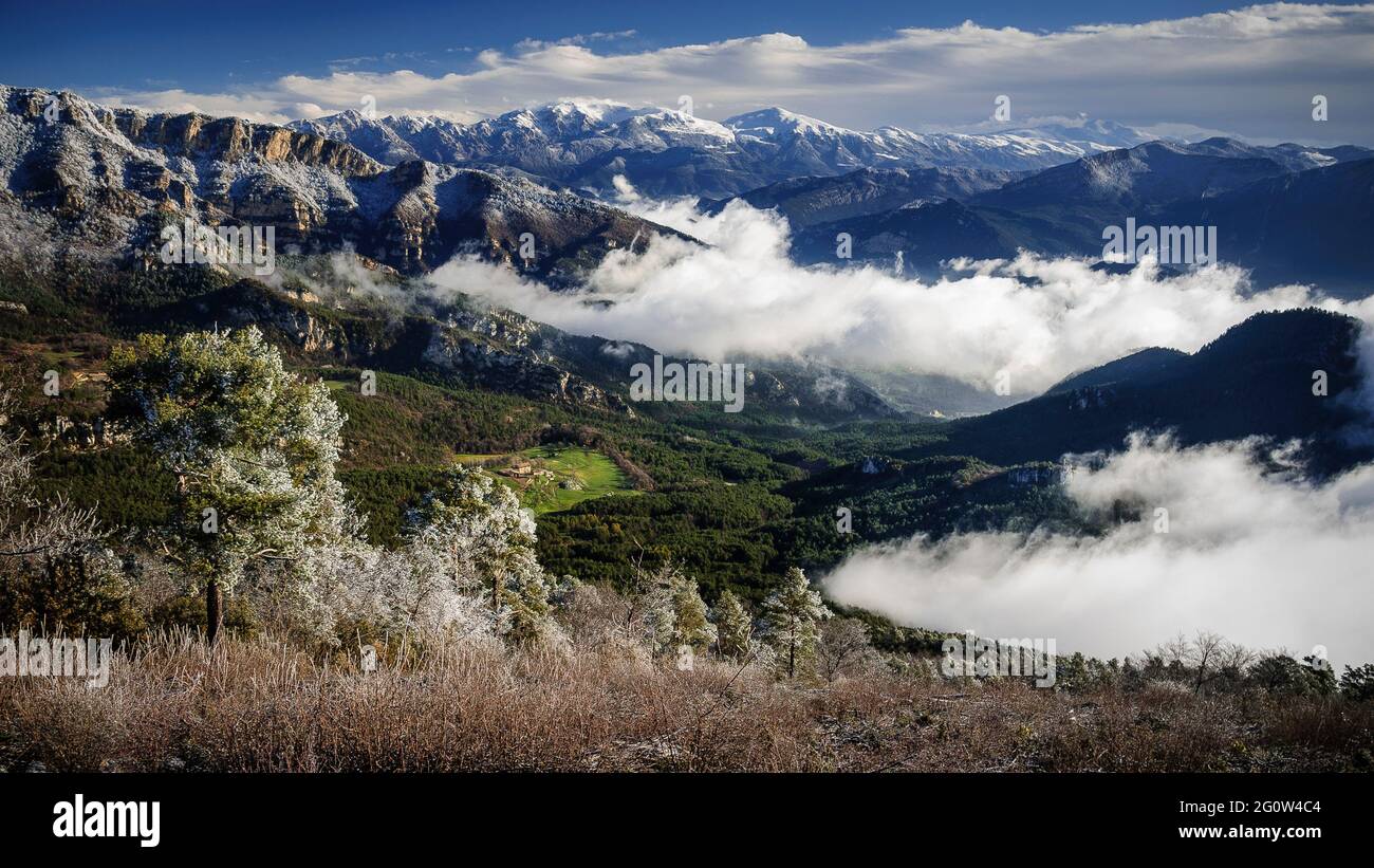 Alt Berguedà region seen from the Figuerassa viewpoint on a foggy and snowy spring morning (Berguedà, Barcelona, Catalonia, Spain, Pyrenees) Stock Photo