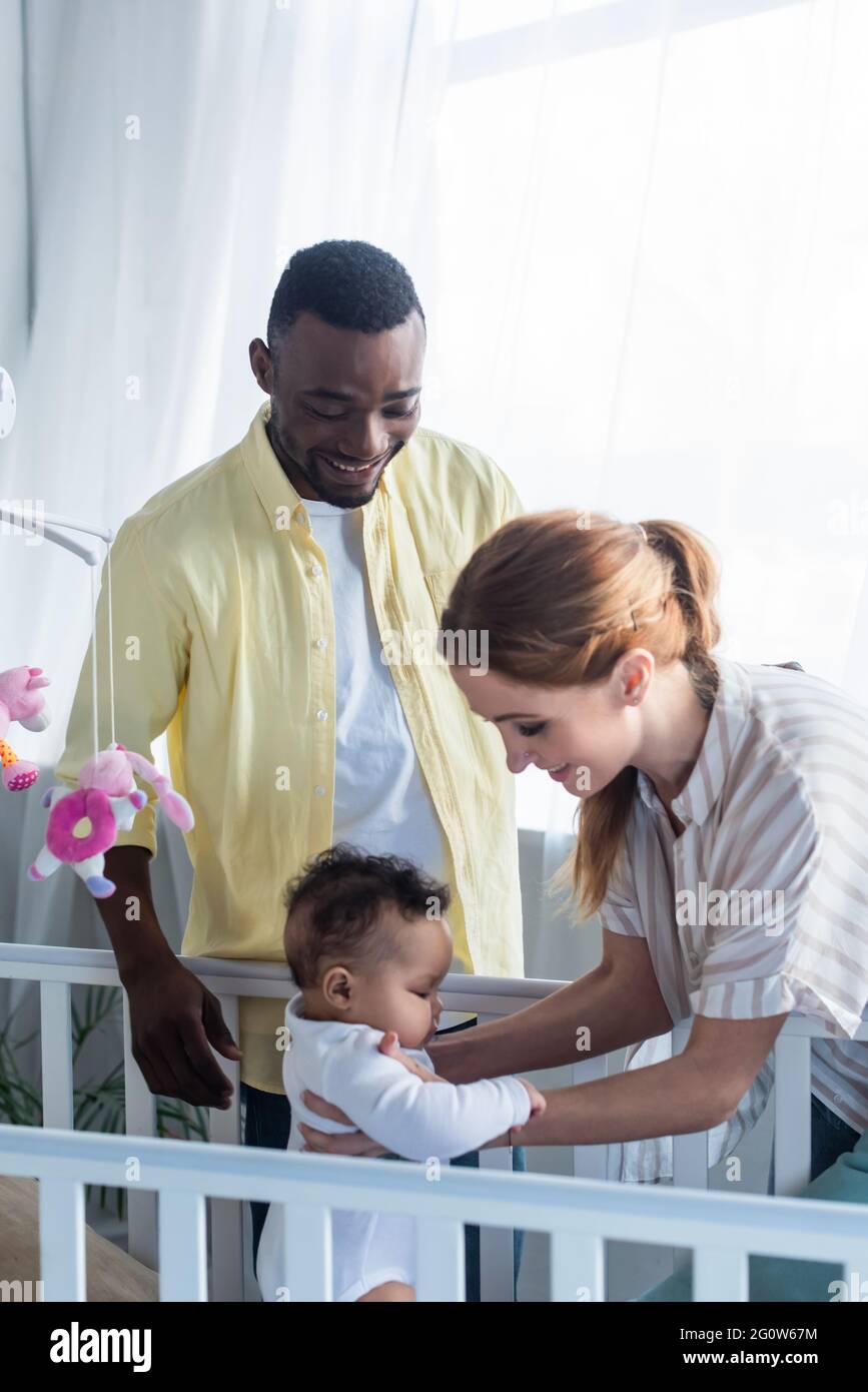 African woman holding infant hi-res stock photography and images - Alamy