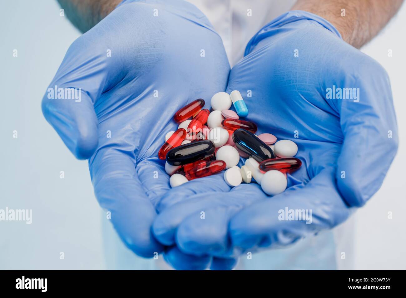 Close up of male doctor hands with medical pills Stock Photo