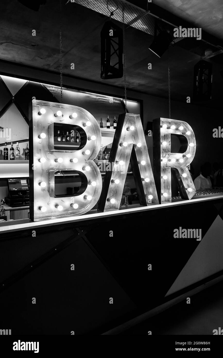 JOHANNESBURG, SOUTH AFRICA - Jan 05, 2021: Johannesburg, South Africa - January 28, 2015: Illuminated Bar sign on countertop at events venue Stock Photo