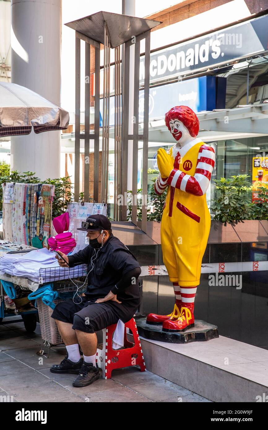 A Vendor With No Customers Appears To Be Blessed By Ronald McDonald Stock Photo