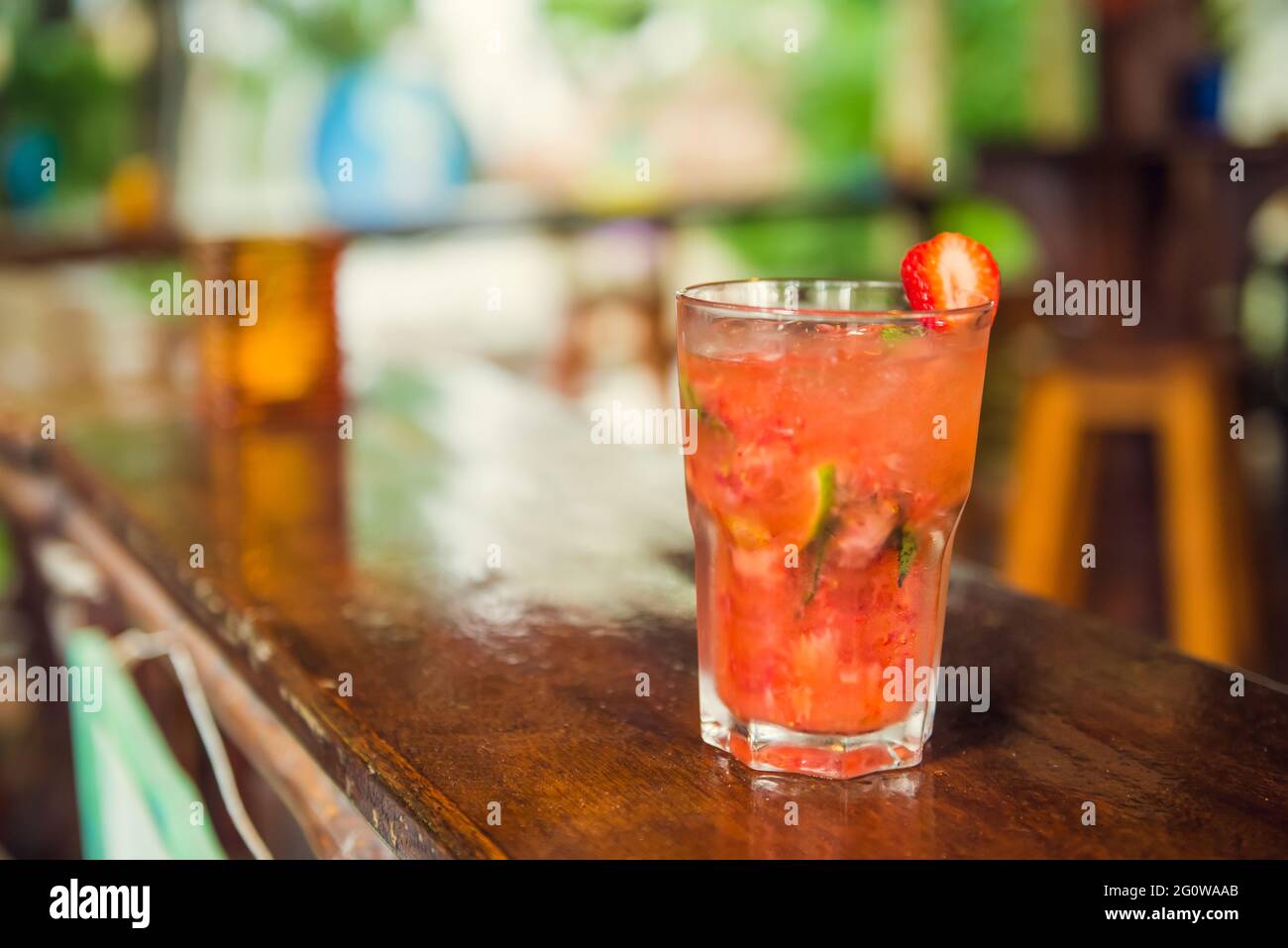 Colorful tropical cocktails on wooden bar. Mixology in pool holiday Stock Photo