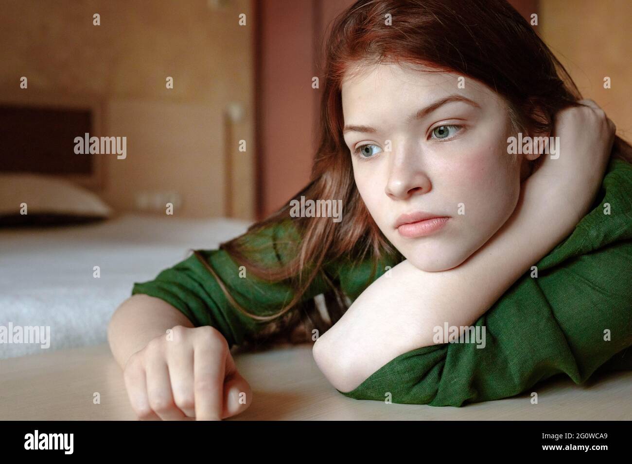 vertical portrait of pensive redhead teenage girl Stock Photo