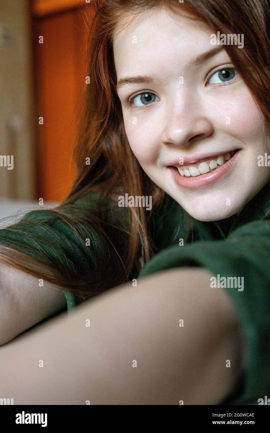vertical portrait of funny redhead teenage girl Stock Photo