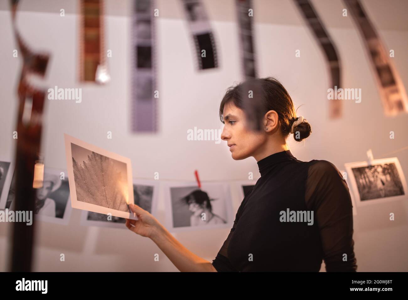 Female holding review photography after printed in traditional process