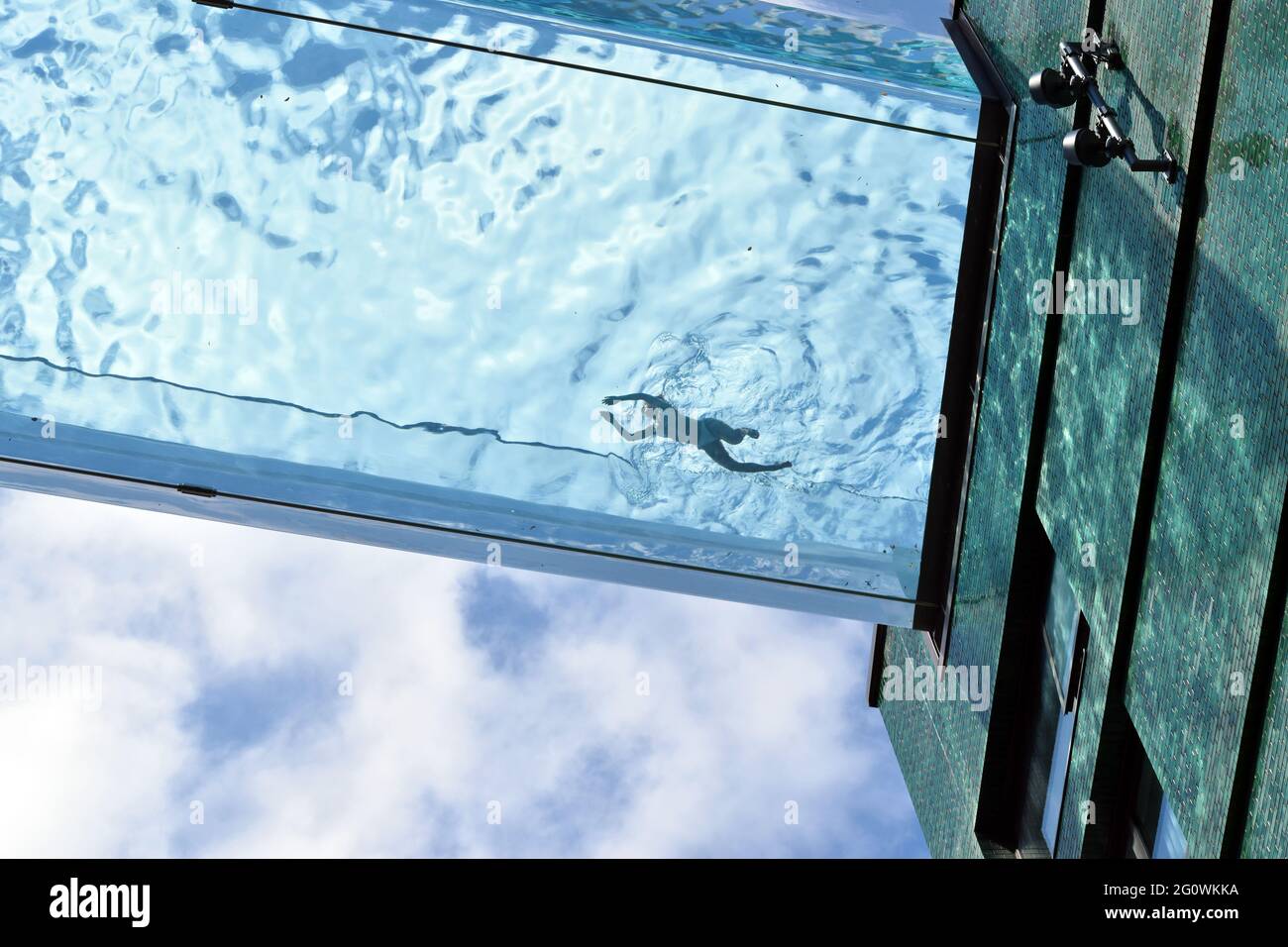 London, UK. 3rd June, 2021. Embassy Gardens sky pool at Vauxhall on sunny day. Credit: JOHNNY ARMSTEAD/Alamy Live News Stock Photo