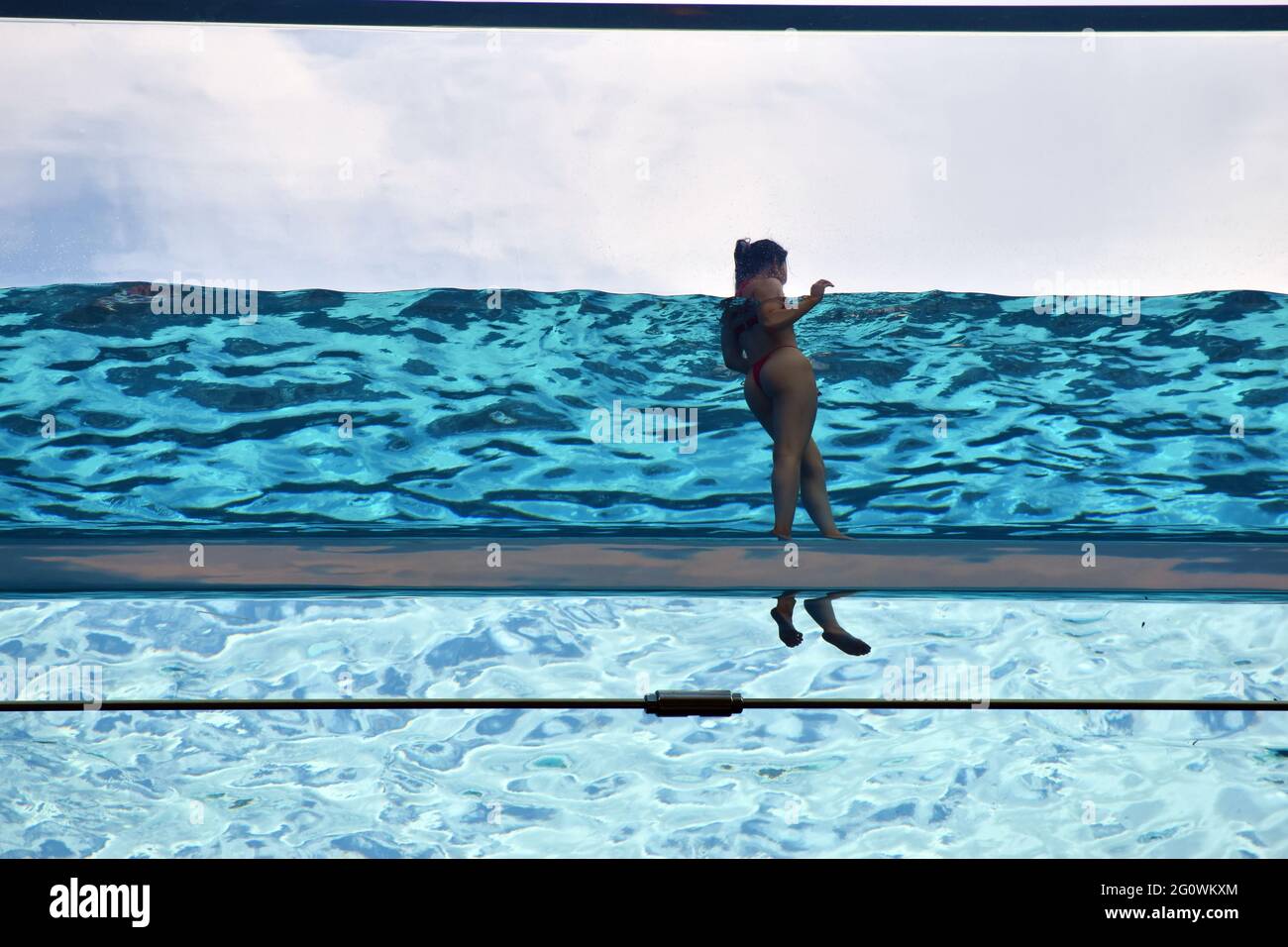 London, UK. 3rd June, 2021. Embassy Gardens sky pool at Vauxhall on sunny day. Credit: JOHNNY ARMSTEAD/Alamy Live News Stock Photo