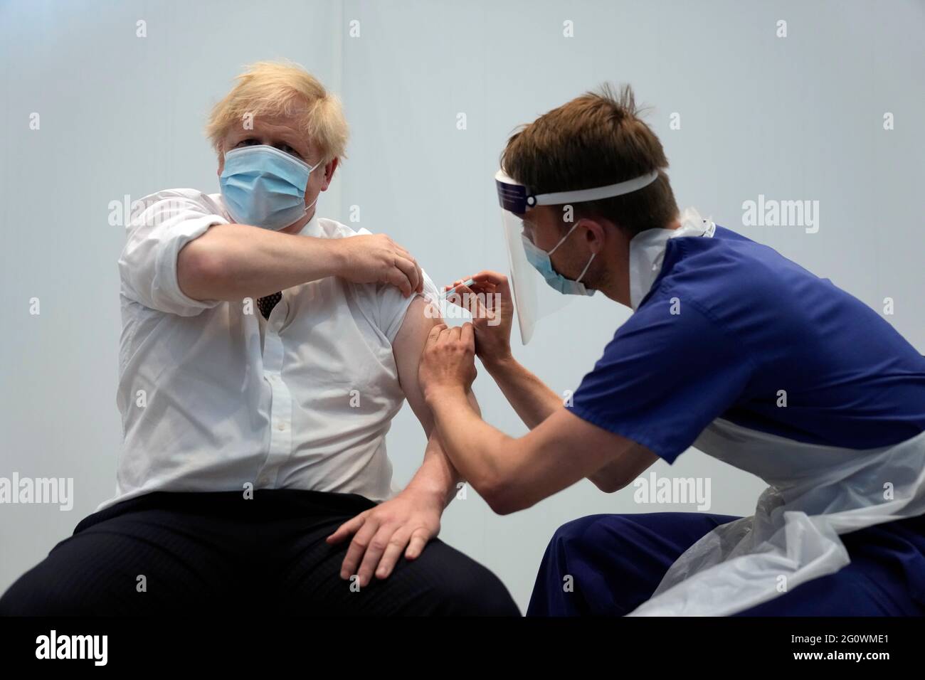 Prime Minister Boris Johnson receives his second jab of the AstraZeneca coronavirus vaccine from James Black, at the Francis Crick Institute in London. Picture date: Thursday June 3, 2021. Stock Photo