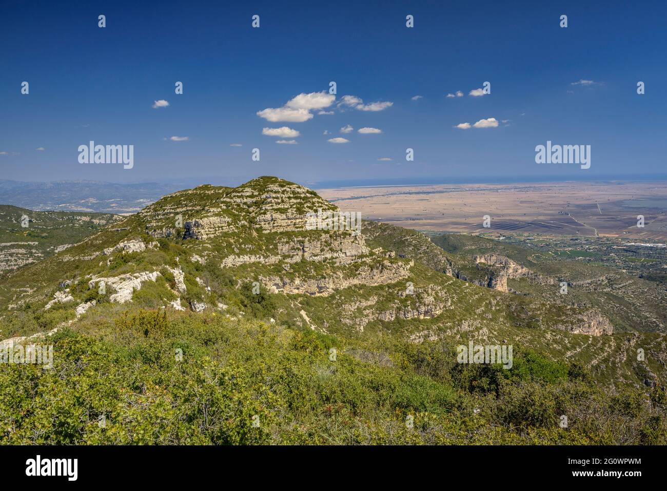 Views from the crest of the Serra de Montsià range looking towards the mountain and, in the background, the Ebro delta (Tarragona, Catalonia, Spain) Stock Photo