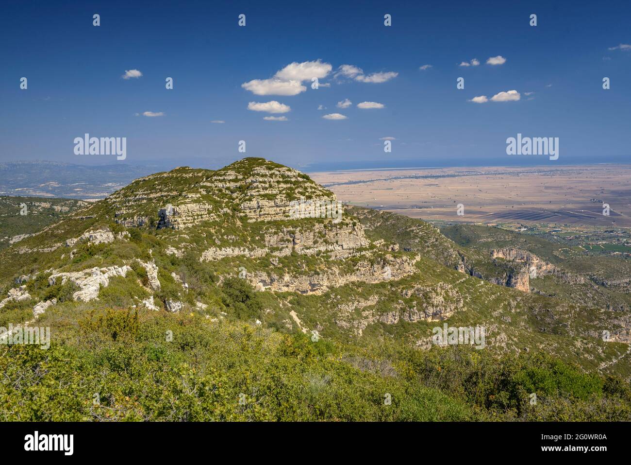 Views from the crest of the Serra de Montsià range looking towards the mountain and, in the background, the Ebro delta (Tarragona, Catalonia, Spain) Stock Photo