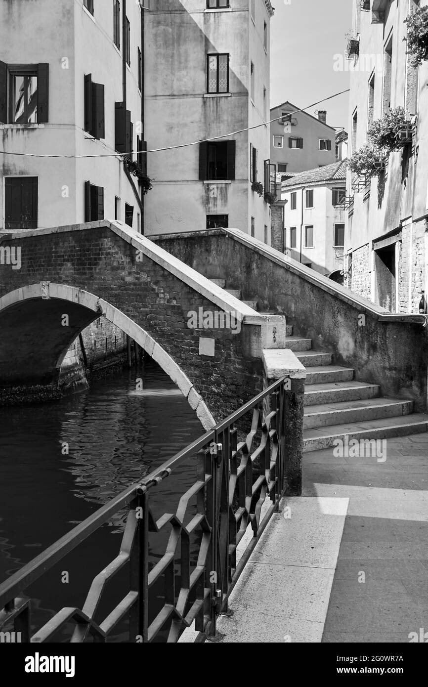 Venice in Italy. Canal with small bridge. Black and white photography ...