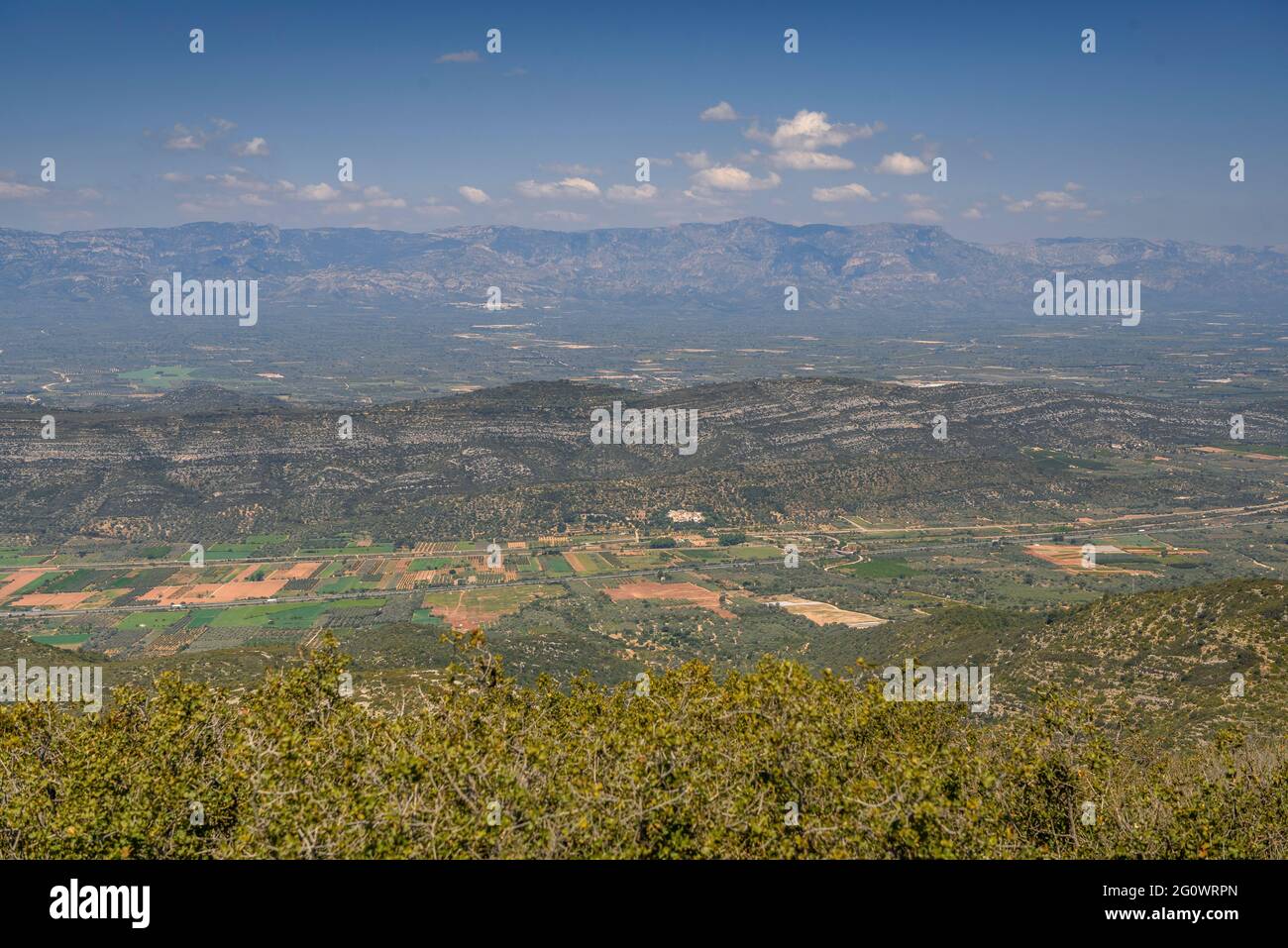 Views from the Torreta de Montsià summit towards the Montsià region. In the background, the Ports mountains (Tarragona, Catalonia, Spain) Stock Photo