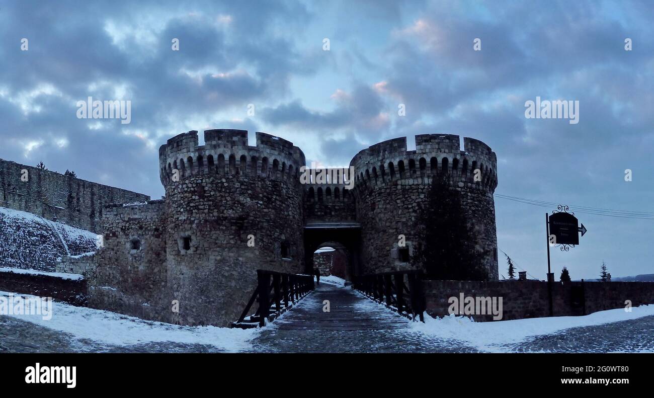 BELGRADE, SERBIA - Jan 18, 2016: Belgrade, Serbia, 18th January 2016. -Zindan gate and wooden bridge of Kalemegdan fortress in winter with snow on the Stock Photo