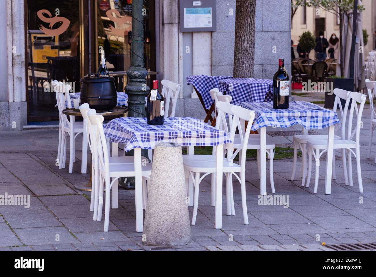 Madrid, Spain - March 20, 2021: Empty terrace of restaurant in Plaza de Oriente in Madrid during restrictions for coronavirus covid-19 pandemic Stock Photo