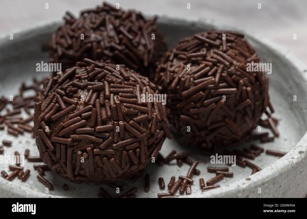 Rum balls with chocolate sprinkles in a bowl. Stock Photo