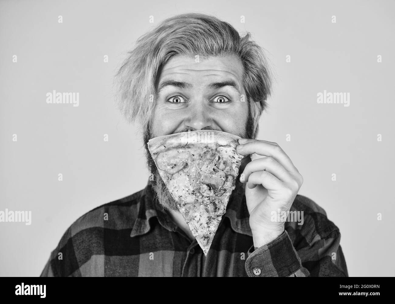 Play with food. Good to last slice. Hungry man going to eat pizza alone. Cheesy taste. In mood for Italian food. Man bearded hipster hold pizza. Pizza Stock Photo